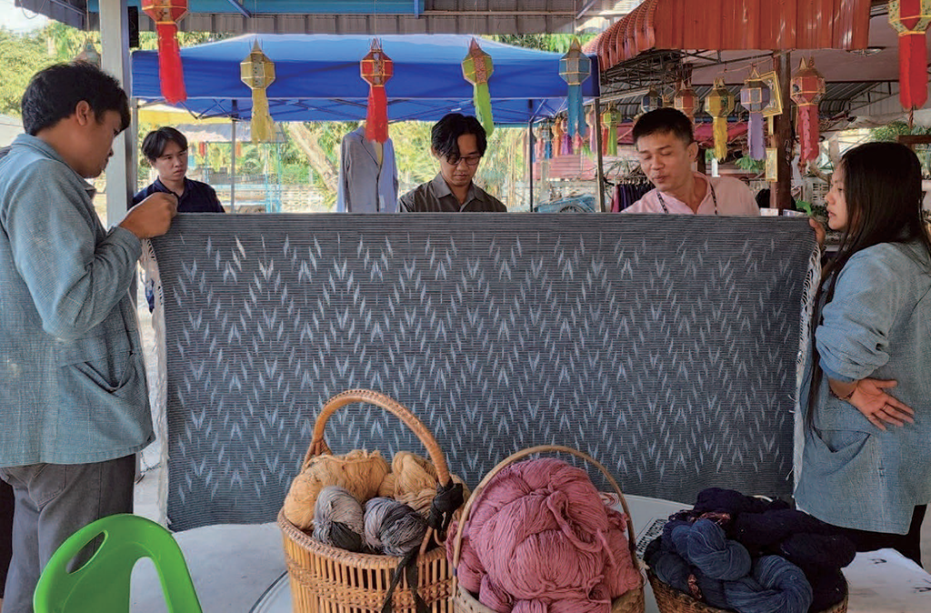 The traditional nam lhai pattern has been transformed into a modern and transparent design using a new tapestry weaving technique. Instead of filling the pattern with different colors of weft yarn, the weft yarn has been omitted to create an open space effect. This results in a lighter and airier fabric that is versatile and suitable for fashionable clothing in hot and humid climates © Suraphon Chaiwongsar