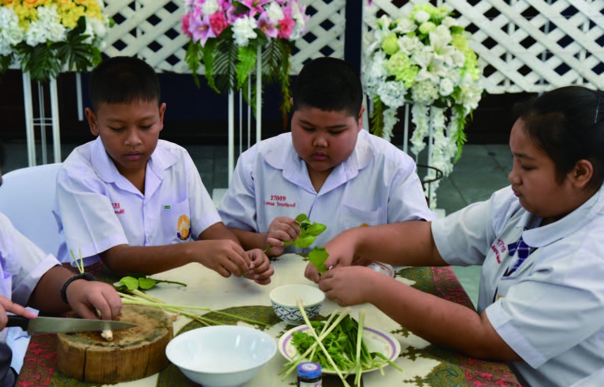 Primary school students formally studying and practicing Tomyum Kung. © Department of Cultural Promotion, Thailand