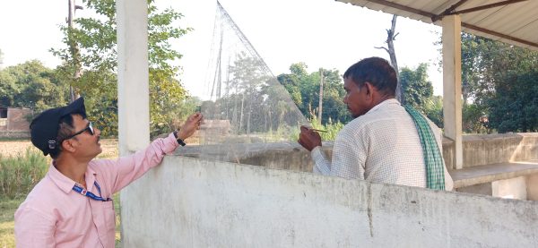 CDNeHCa faculty member observing traditional fish net weaving process, Hadiapokhari, Nawalparasi district, Nepal © CDNeHCA, TU